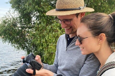 Happy guests, reviewing their photos