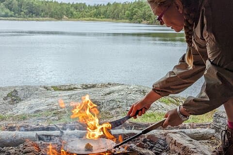 cooking traditional lunch by a secret lake and wild life shelter