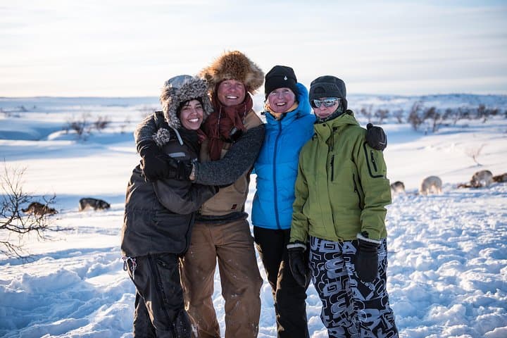 Guest and guides after making sure the dogs are safe and fed