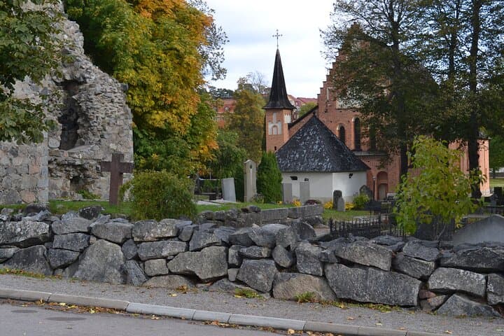 The ruins of St Olof church at left and Sigtuna church in the background