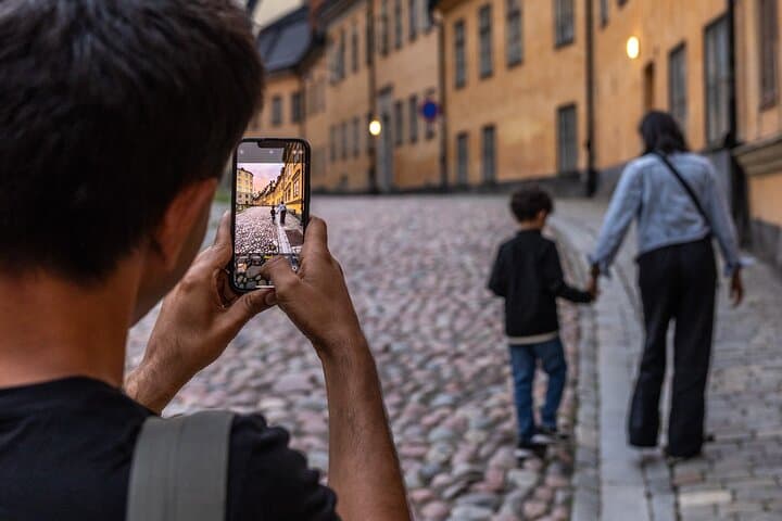 Guest taking a photo of his family