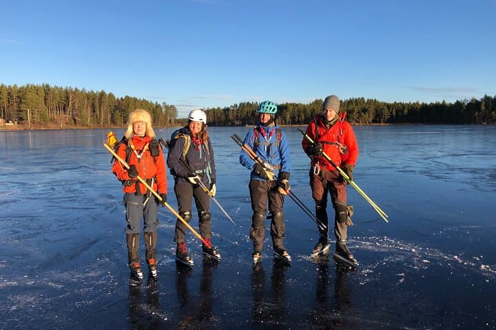 Four nice skaters wait to skate over fine ice.