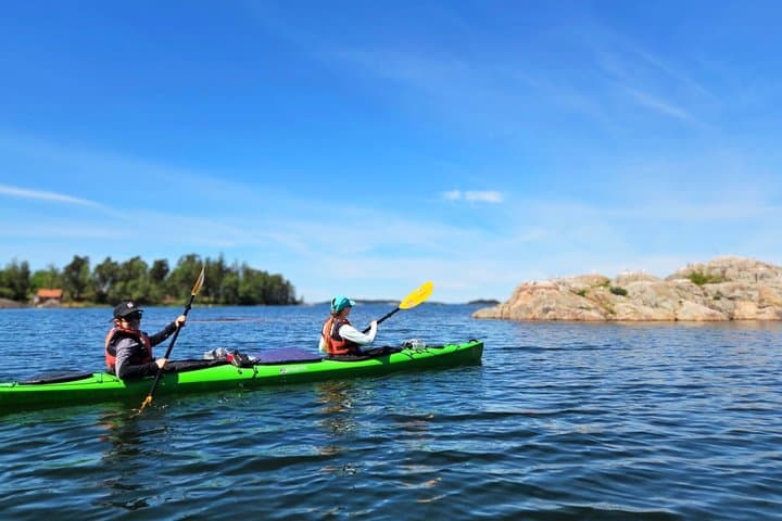 Sea kayaking in the Stockholm Archipelago — guided paddling between islands on our 2-day kayak & wild camp adventure.